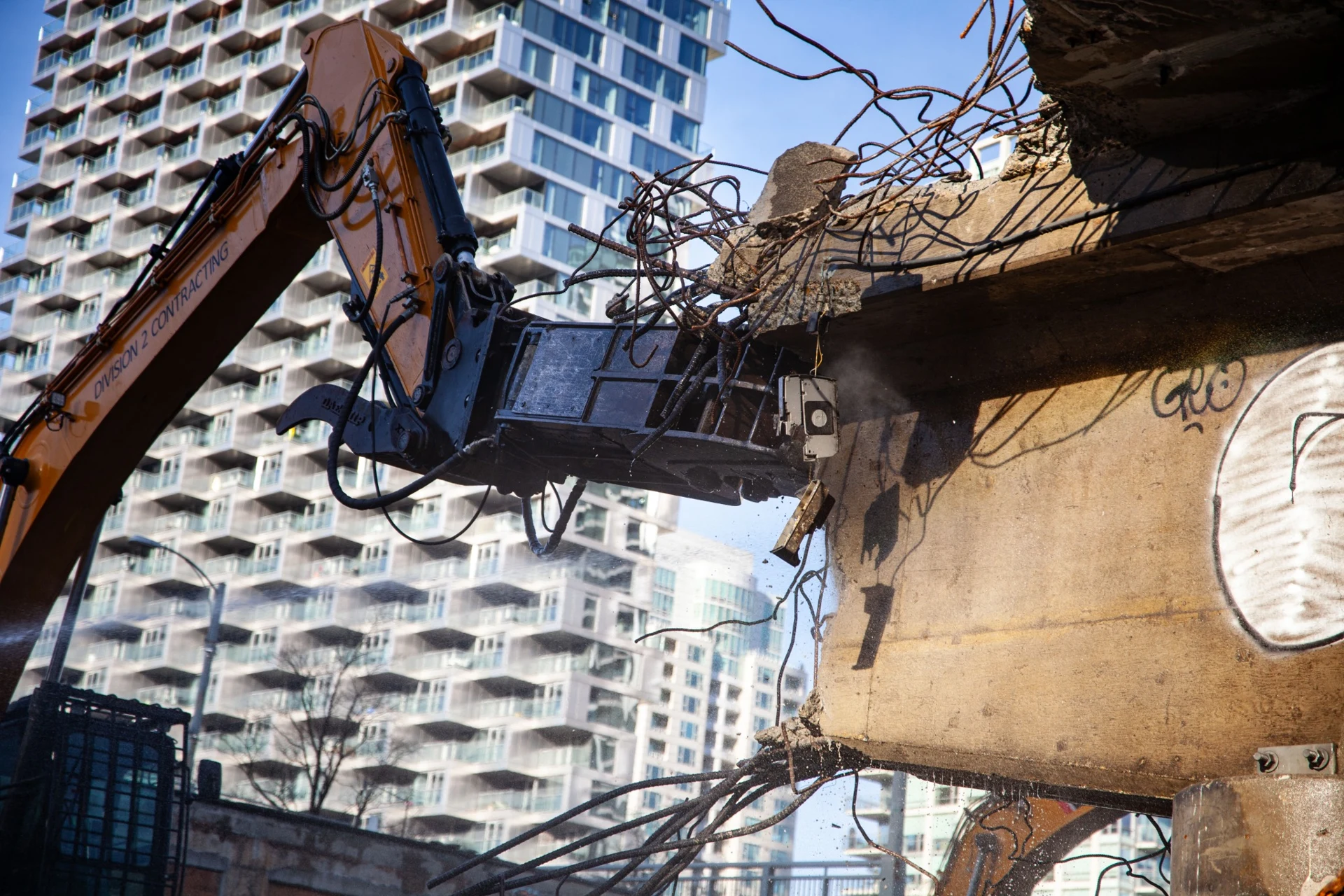 Division 2 excavator removing bridge concrete